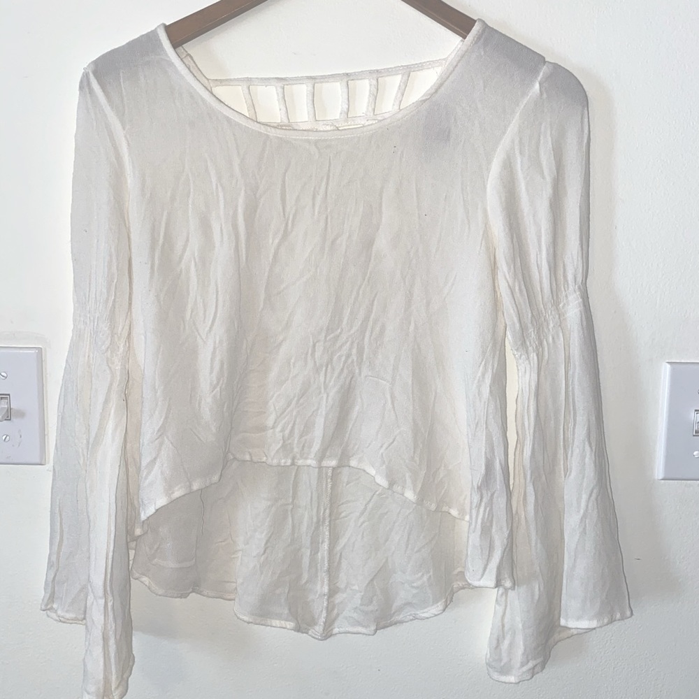 White crop top with flare sleeves and strapped back